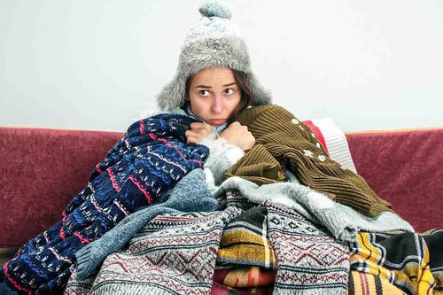 young-sick-woman-with-flue-sitting-sofa-home-studio-covered-with-knitted-warm-clothes-illness-influenza-pain-concept-relaxation-home-healthcare-concepts